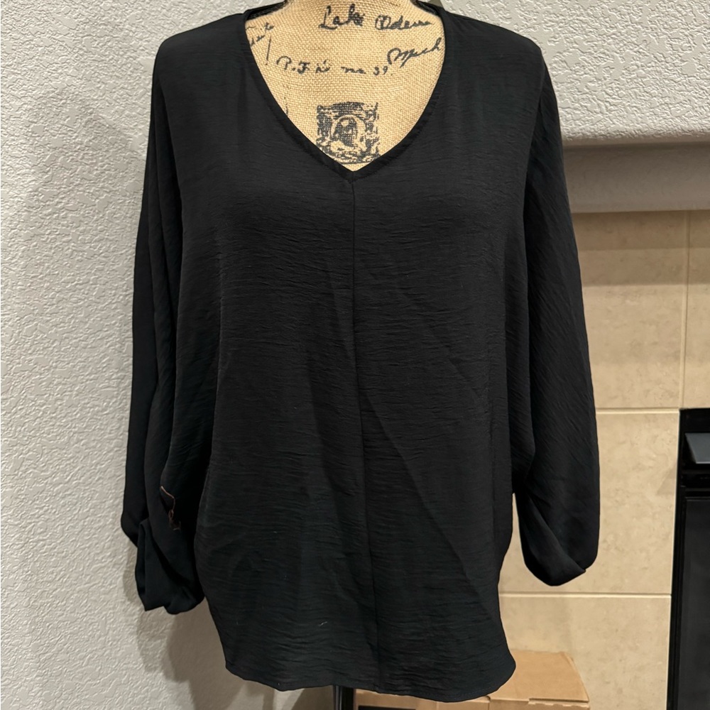 Black blouse with batwing sleeves